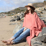 the Alicia Adams Alpaca Classic Cape, a timeless piece available in solid or herringbone patterns. With over 100 colors to choose from, it's perfect for any style preference. The cape effortlessly layers over sweaters and jackets, making it a must-have staple in every wardrobe. 